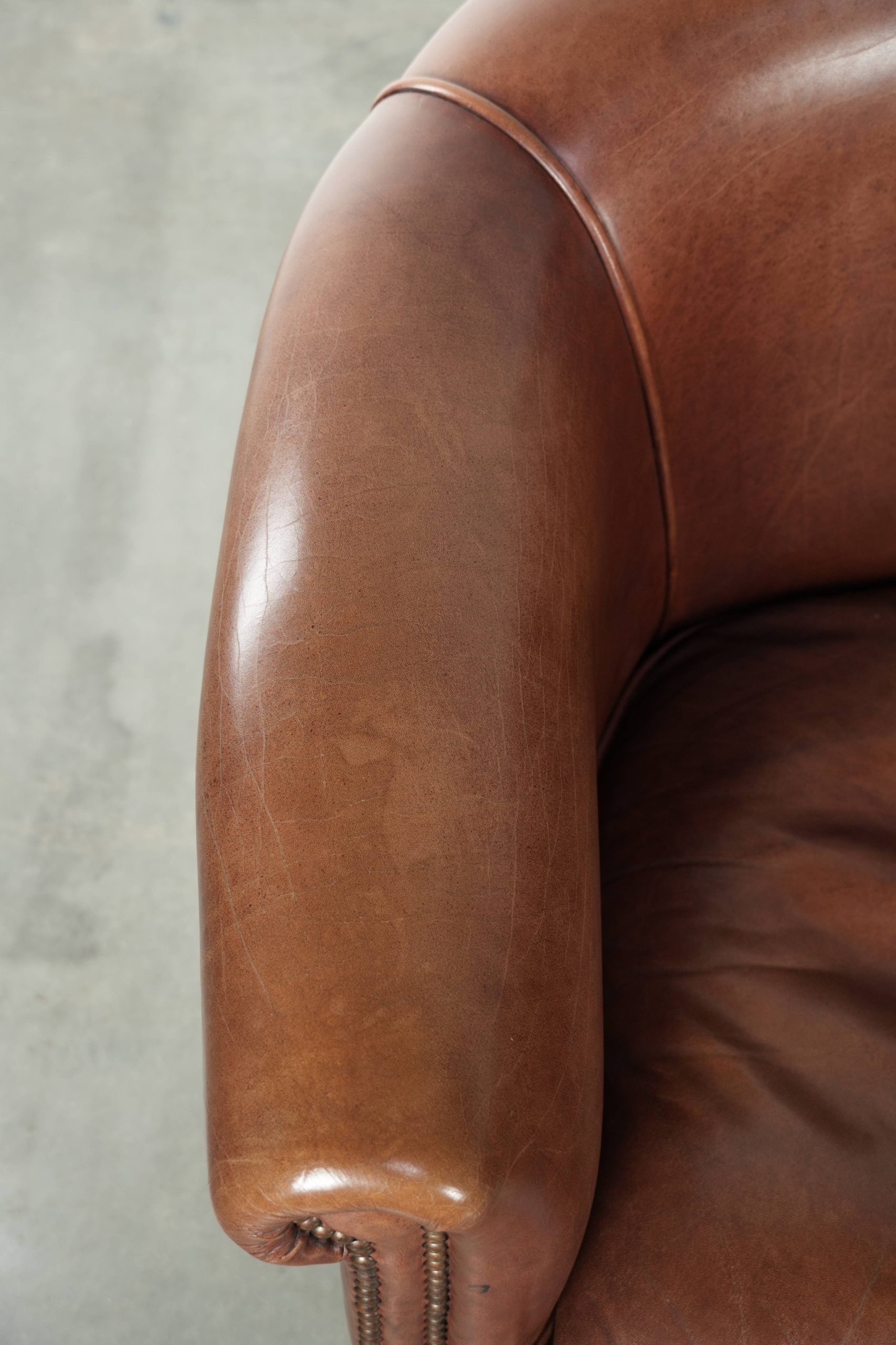 Cow leather club armchair in beautiful dark cognac colour in English style