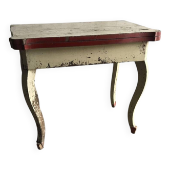 Rustic red and cream wooden dining table, moulded top, 1950s.