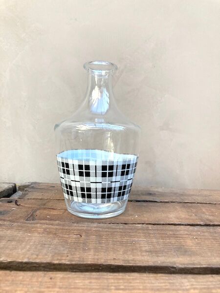 Vintage decanter with black and white tiles