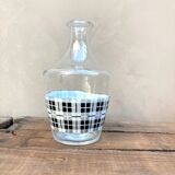 Vintage decanter with black and white tiles