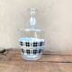 Vintage decanter with black and white tiles