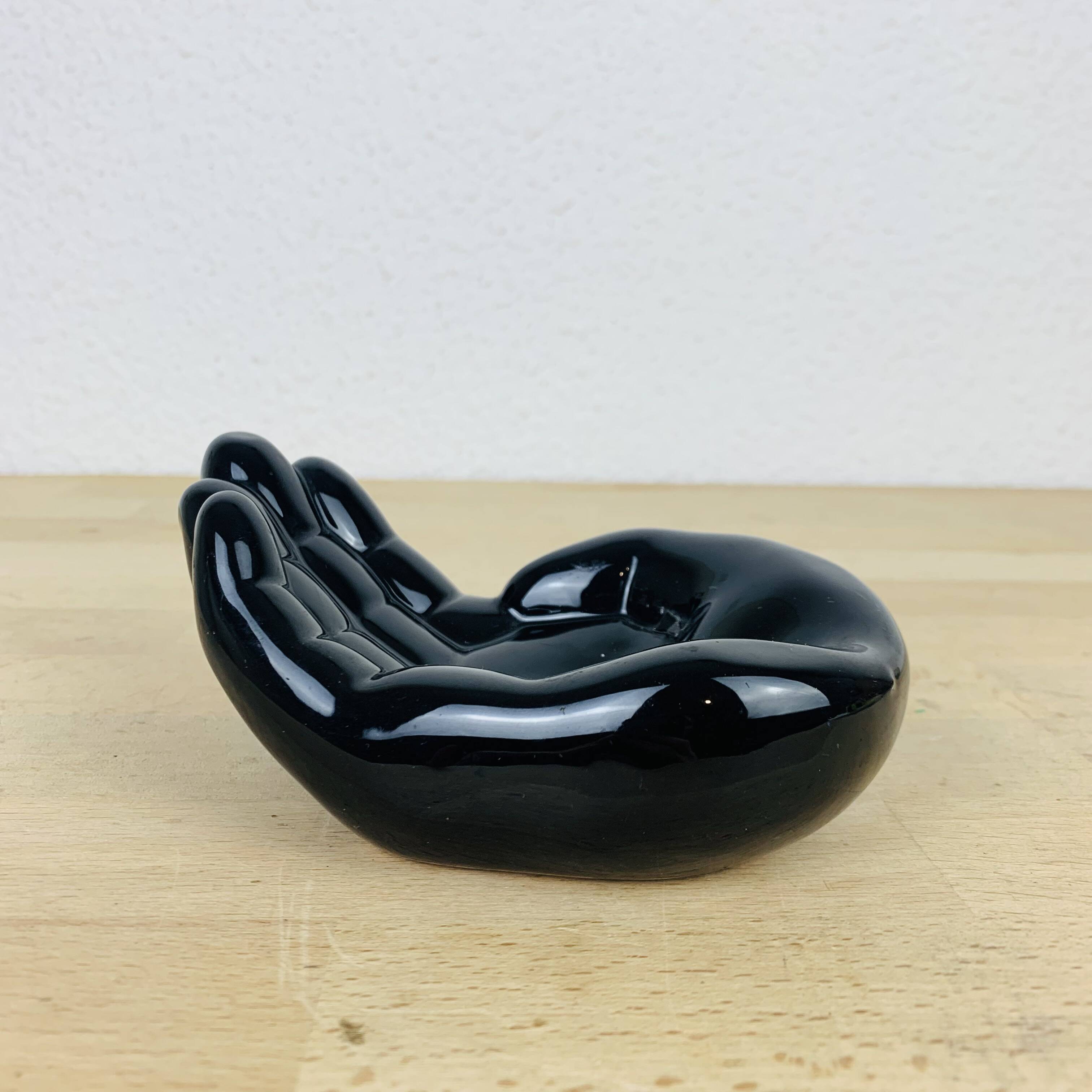 Vintage black ceramic hand pocket empty
