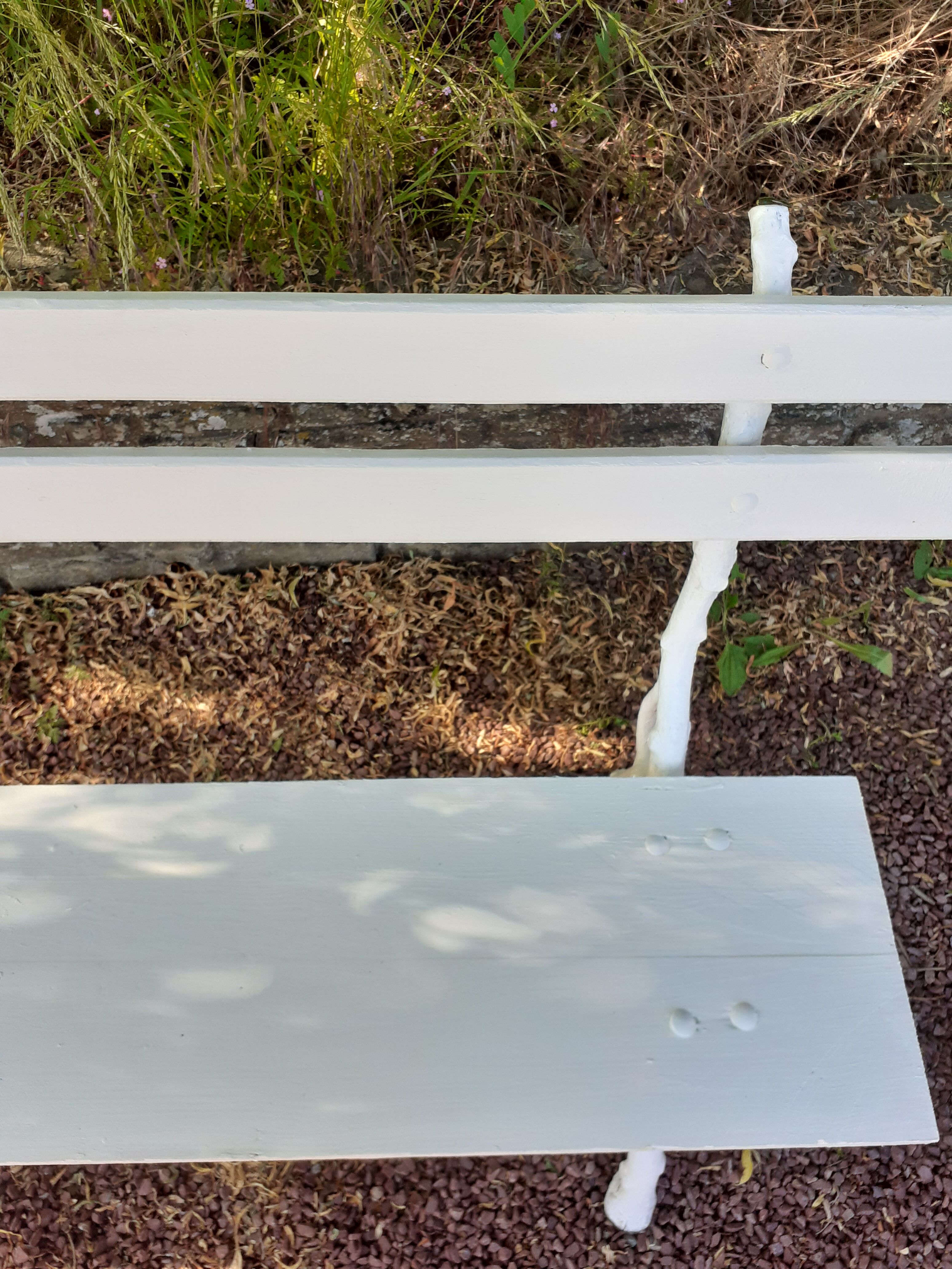 Old garden bench with cast iron feet and wooden planks