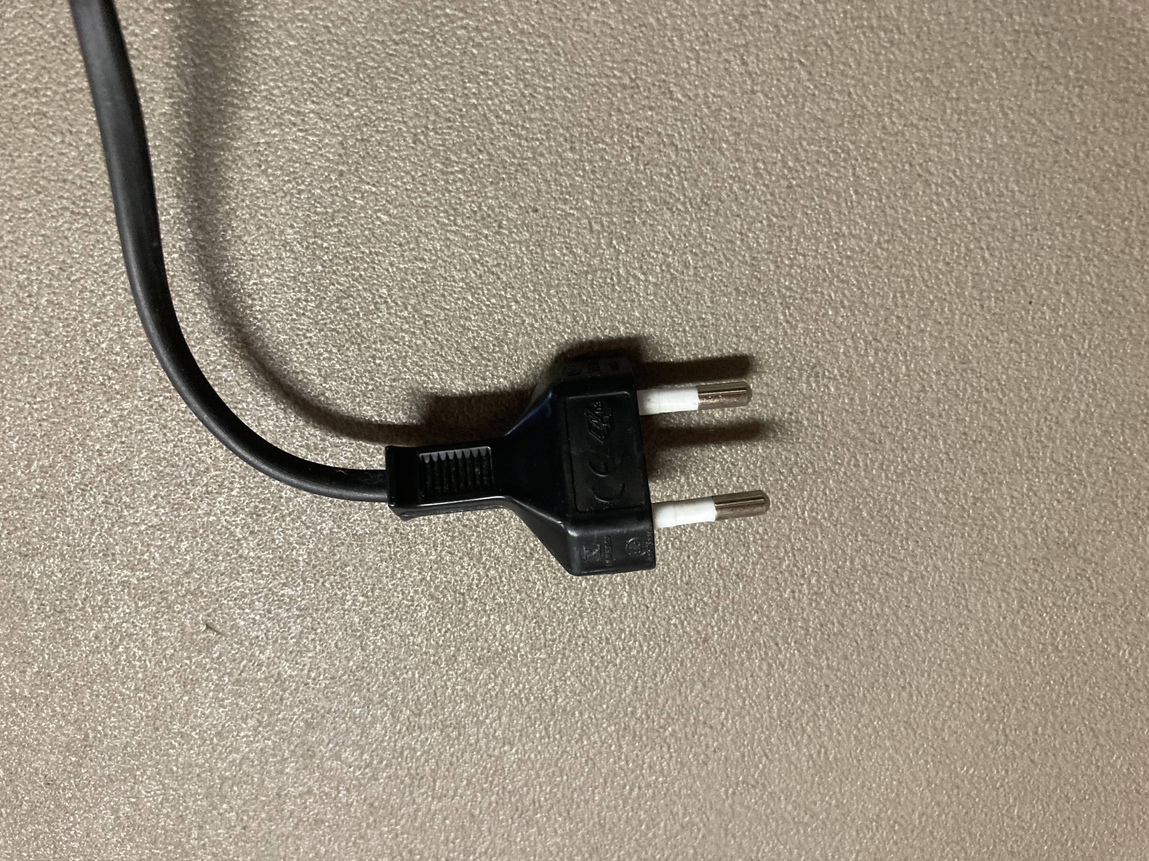 Black metal tripod floor lamp