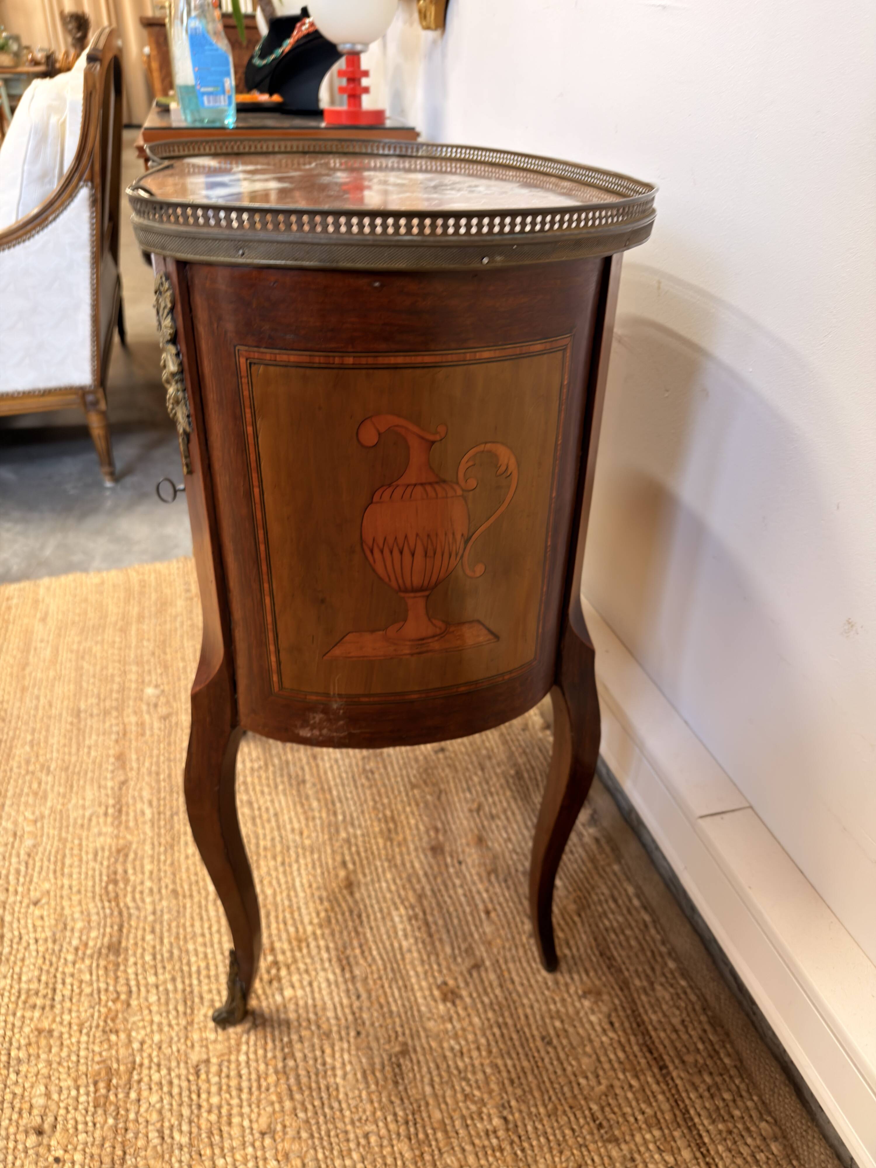 Transitional style side table, with a red marble top.