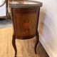 Transitional style side table, with a red marble top.
