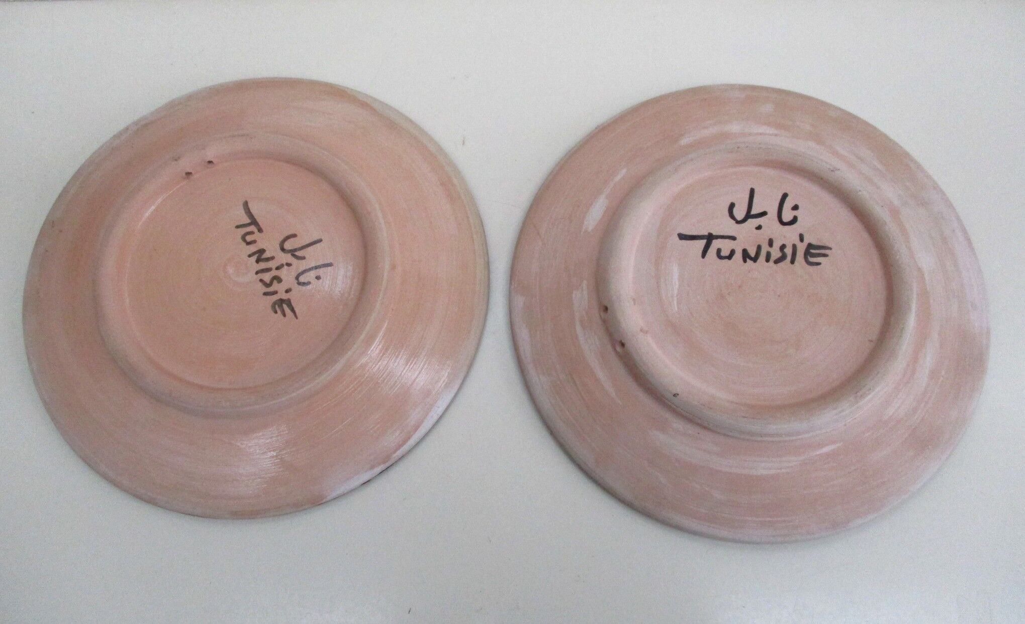 2 hand-decorated ceramic plates