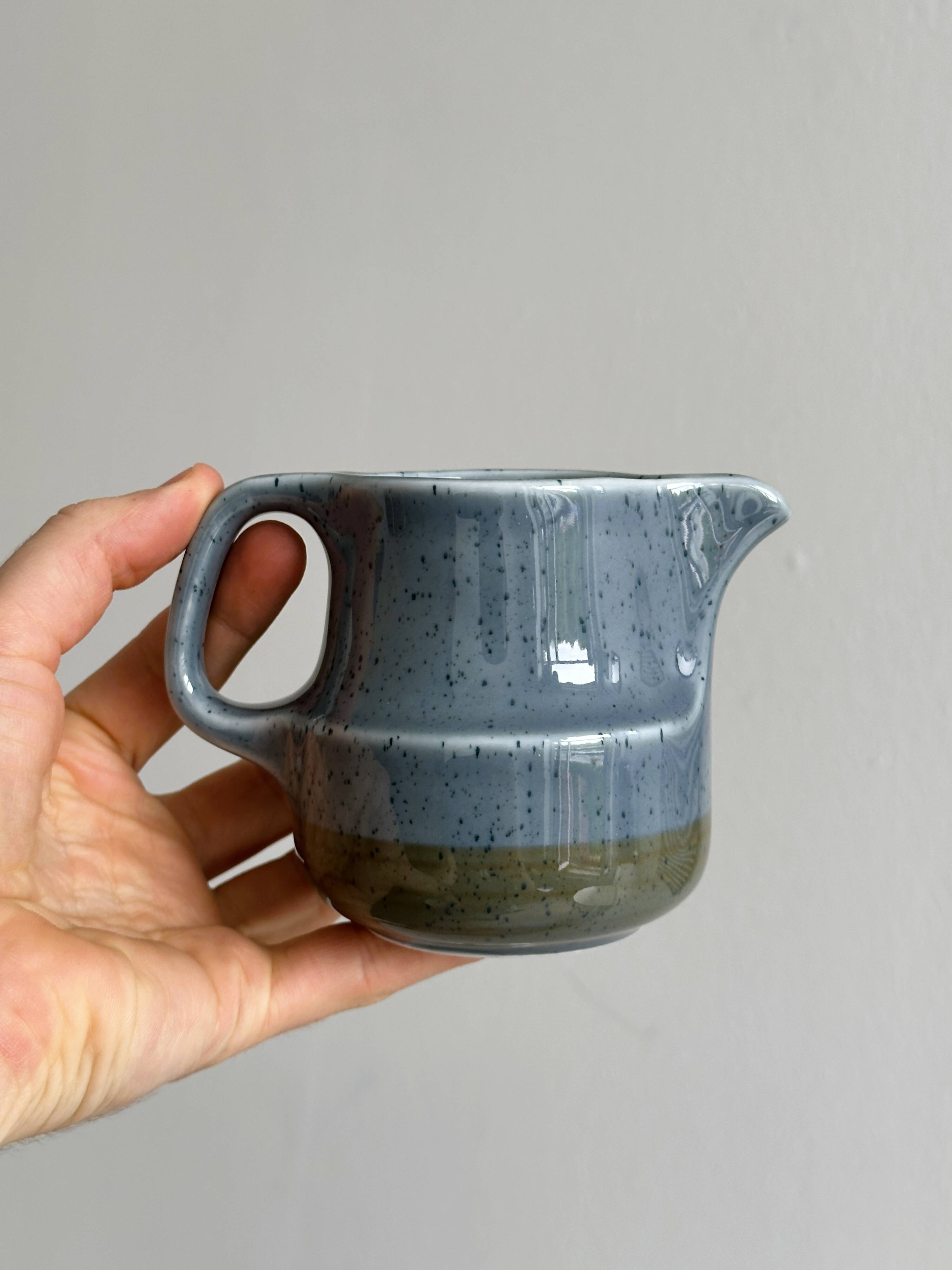 Blue and beige ceramic milk jug