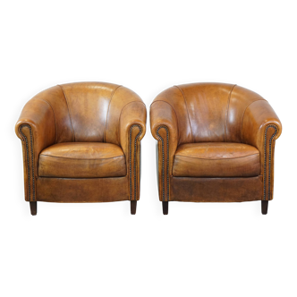 Lot de 2 fauteuils club en cuir de mouton coloris cognac