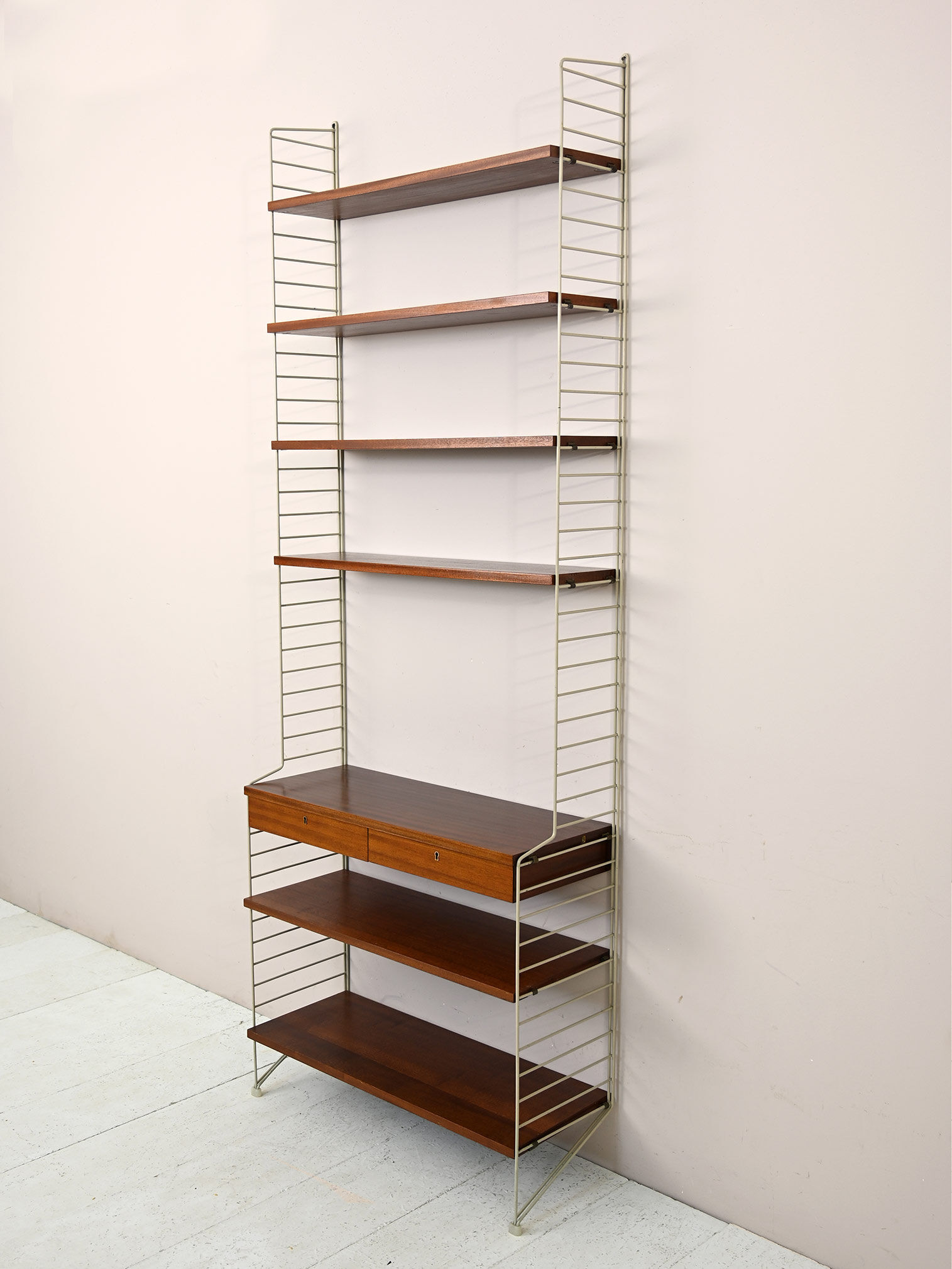 'string' bookcase with metal frame