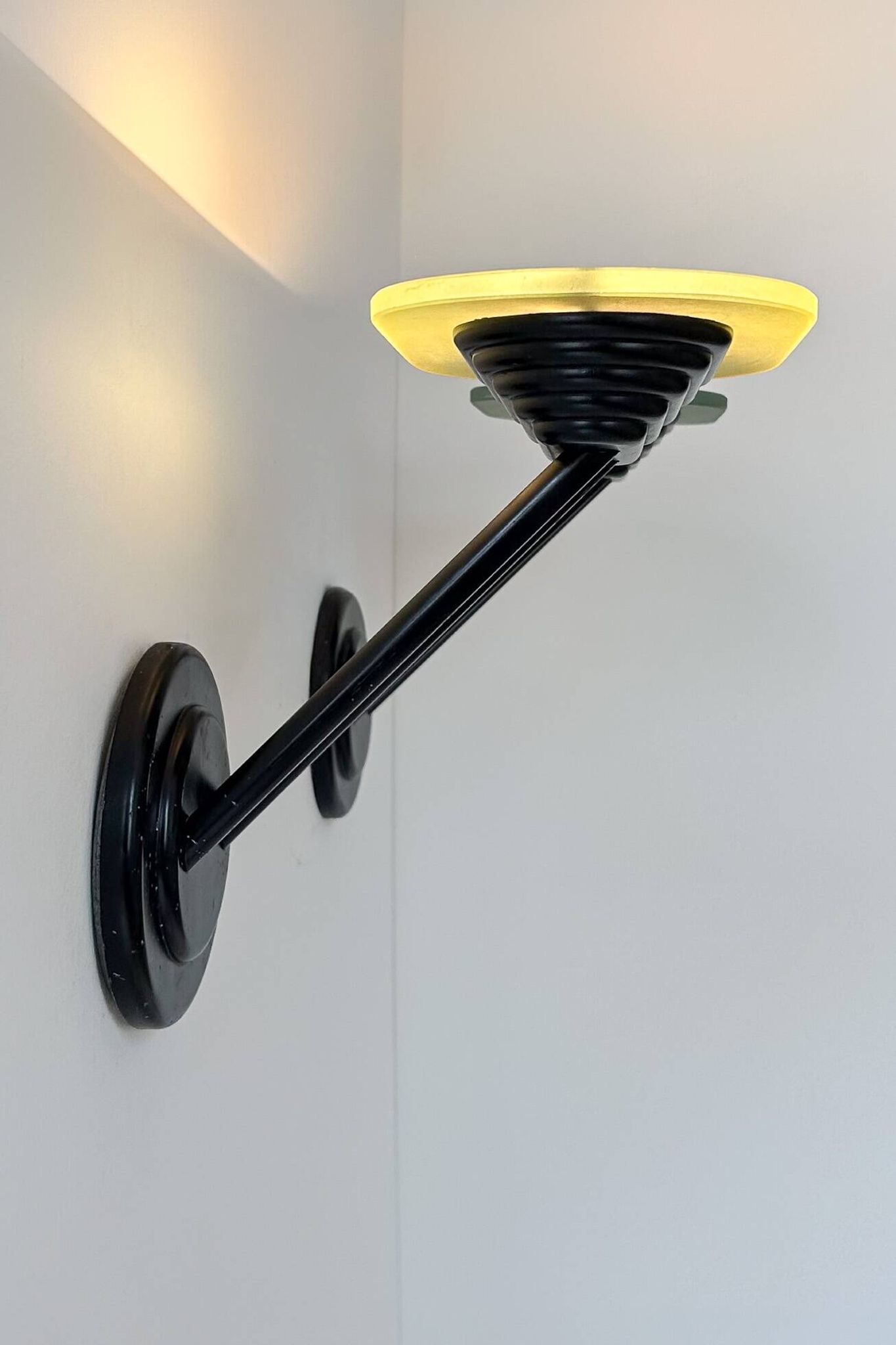 Pair of vintage wall lights in black metal and frosted glass, Italy 1980.
