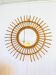 Vintage sun mirror in woven rattan – 60s/70s