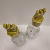 pair of decanters, bottles or jars, made in crystal with a ceramic tap enameled in green color