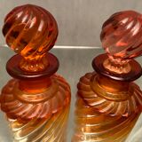 Pair of Baccarat twisted tinted crystal bottles