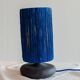 Table lamp in black stoneware and natural raffia.