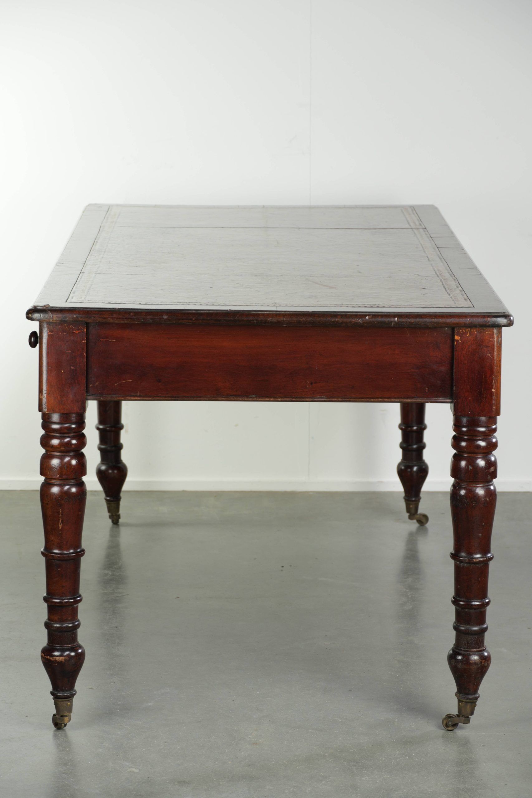 Antique English writing desk from the late 19th century with a warm colour