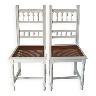 Pair of white canning Henri II chairs