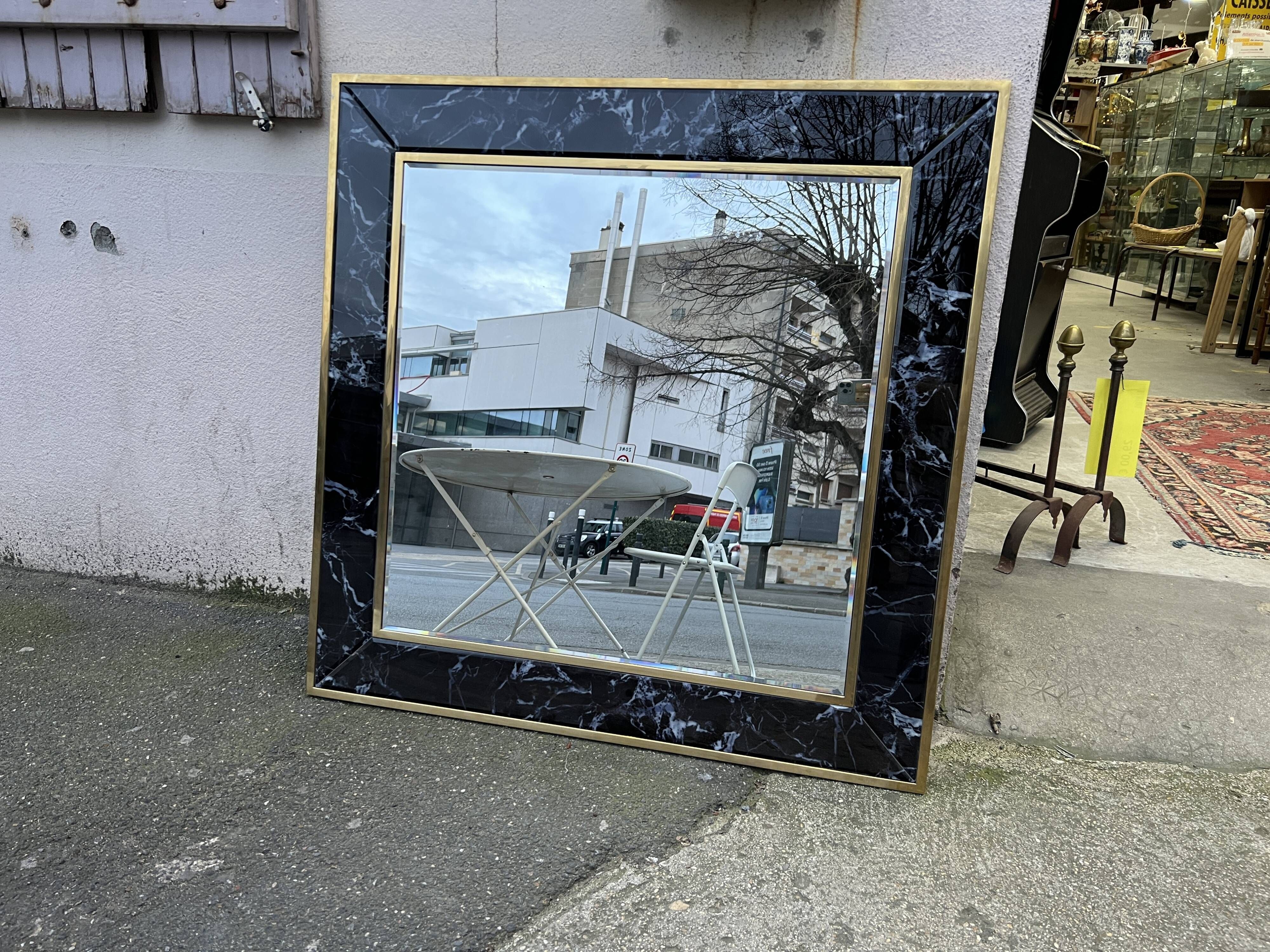 Mirror in brass and white veined black marble from the 70s