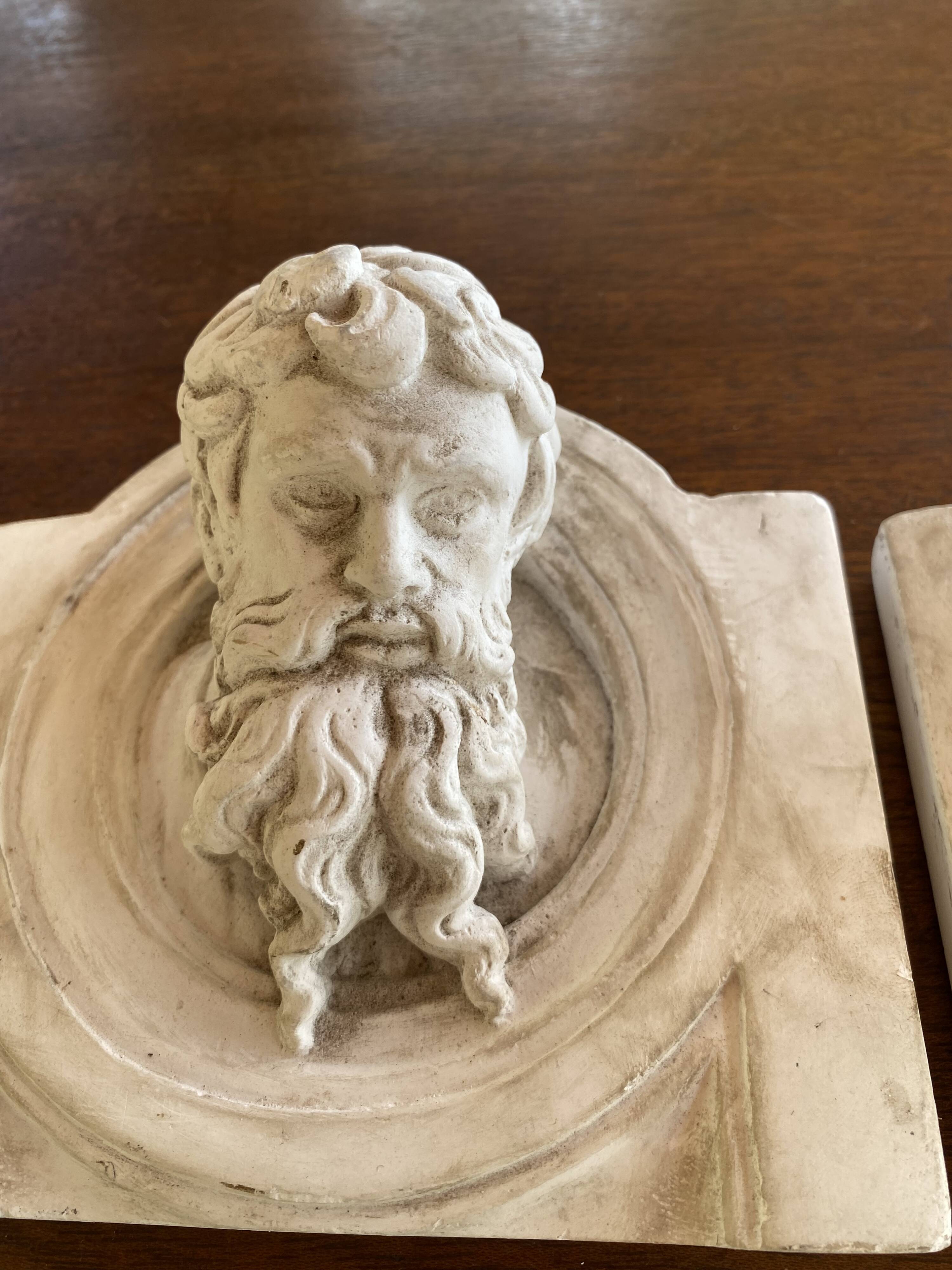 Two moulds; plaster heads