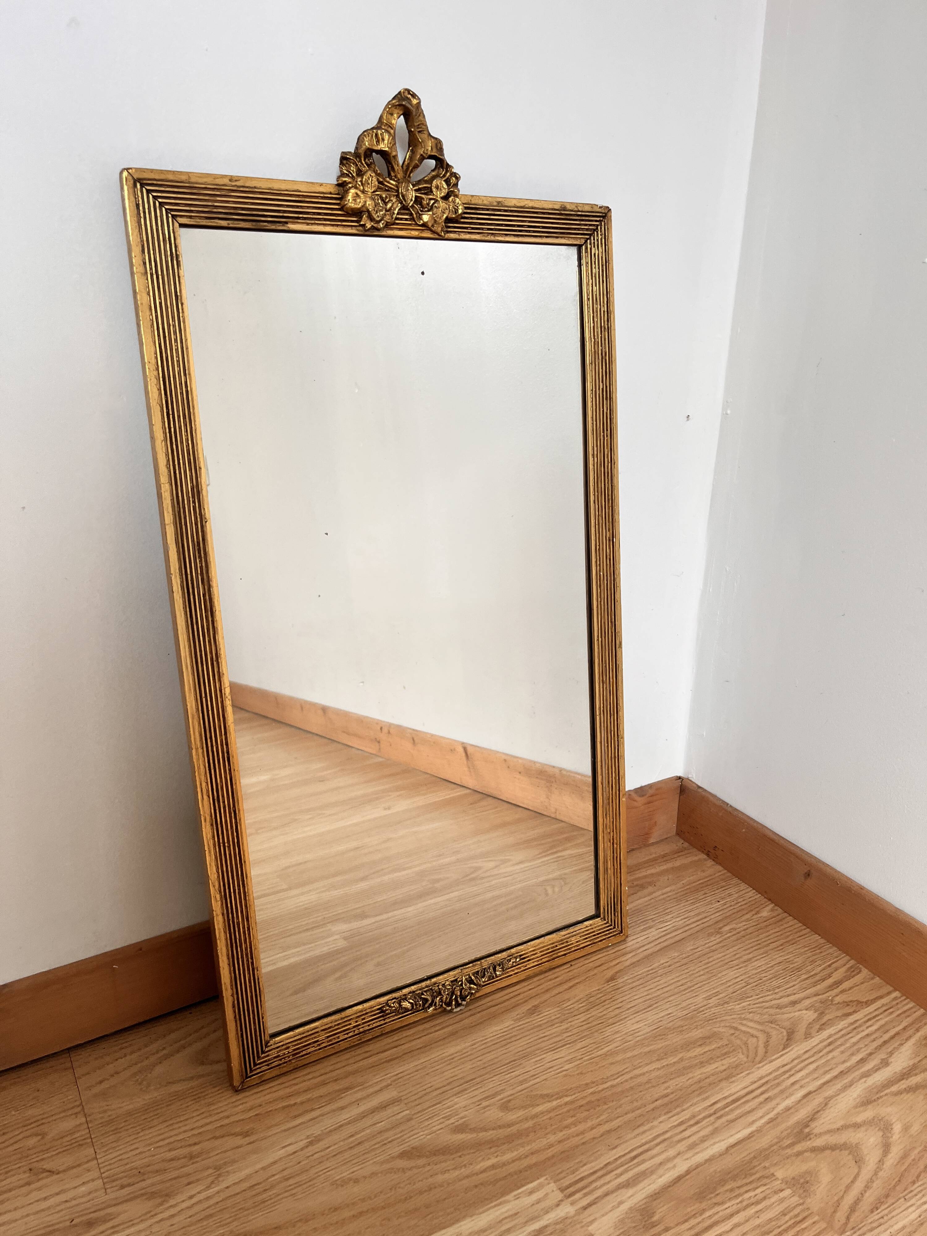 Golden mirror in Louis XVI style