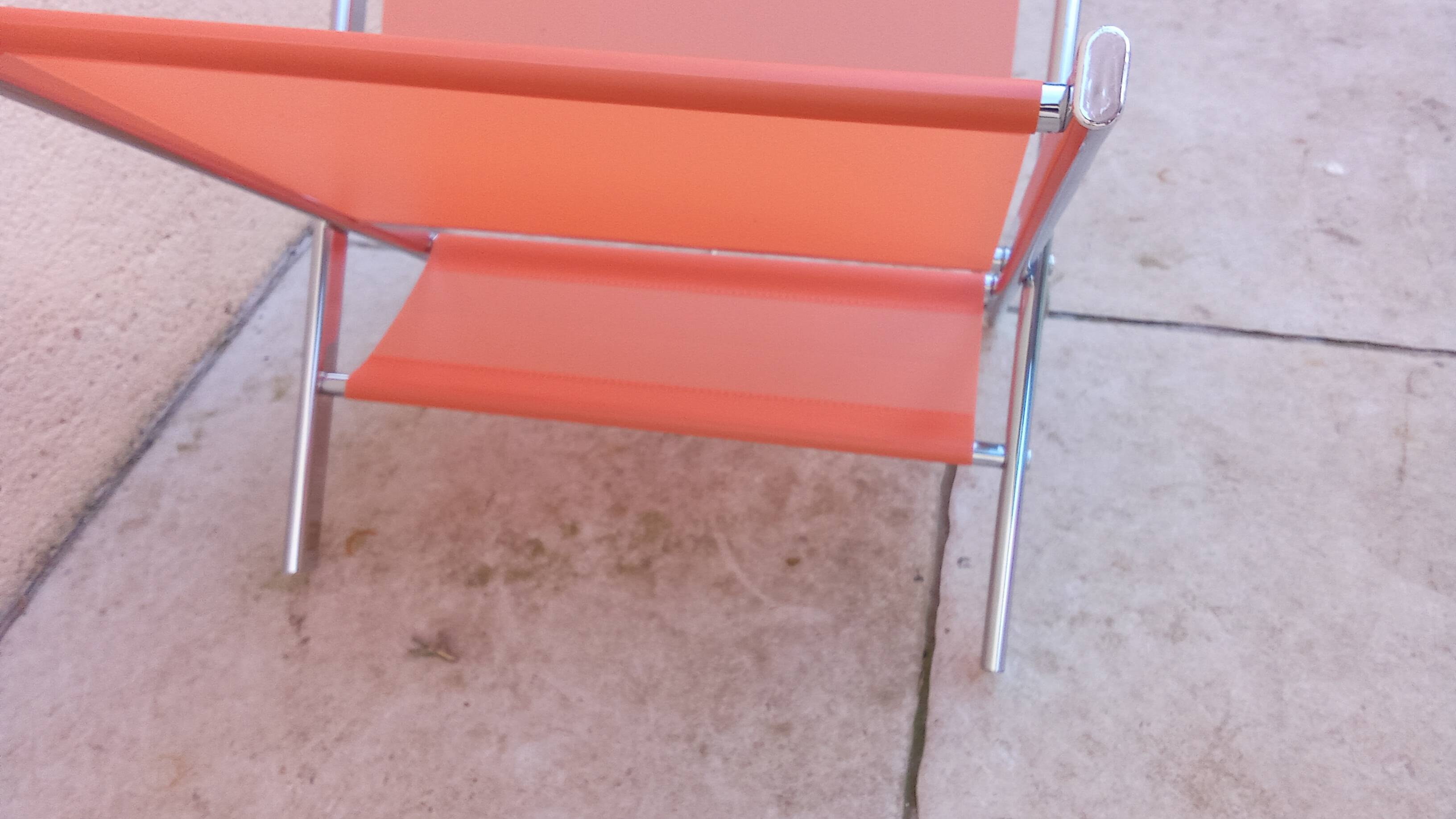 Vintage chrome and orange magazine rack from the 70s and 80s