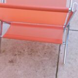 Vintage chrome and orange magazine rack from the 70s and 80s