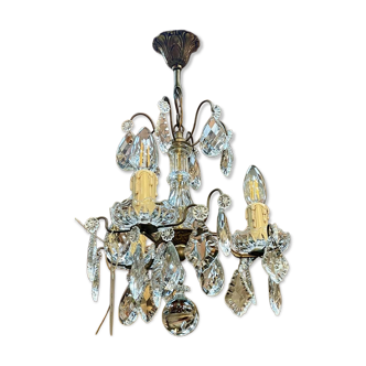 Three-light chandelier in bronze and cut crystal, early 20th century work.