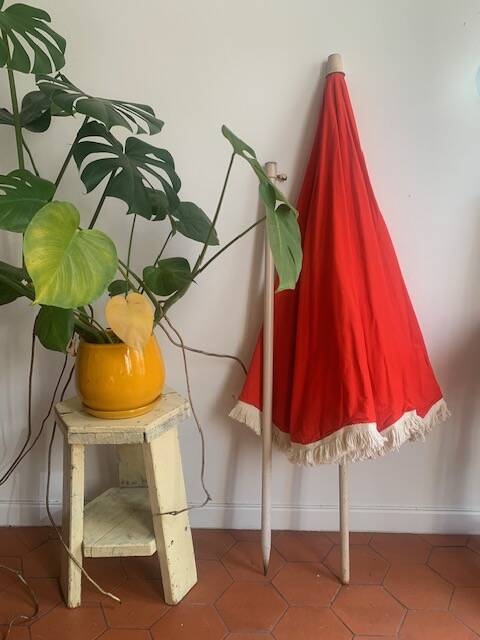 Large floral tilting beach umbrella with cotton fringes, 1960