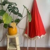 Large floral tilting beach umbrella with cotton fringes, 1960