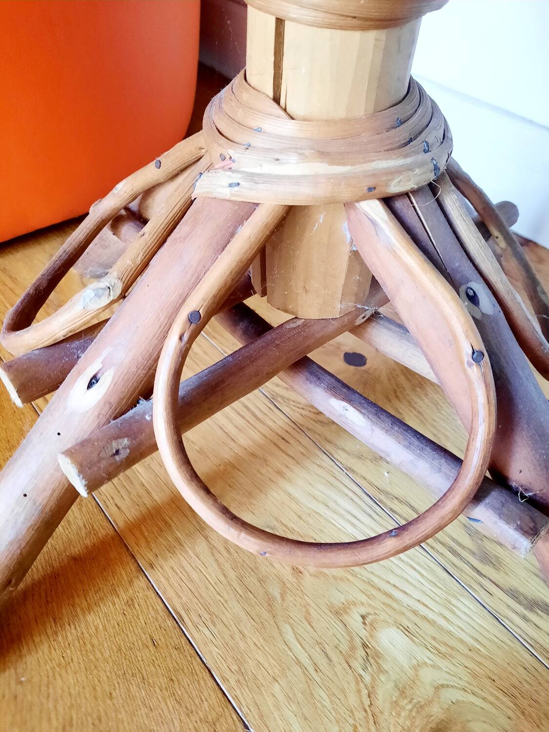 Old bamboo/rattan table with woven palm leaves.