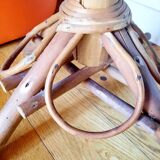 Old bamboo/rattan table with woven palm leaves.