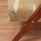 Pair of vintage lounge chairs in brown jacquard fabric and wood.