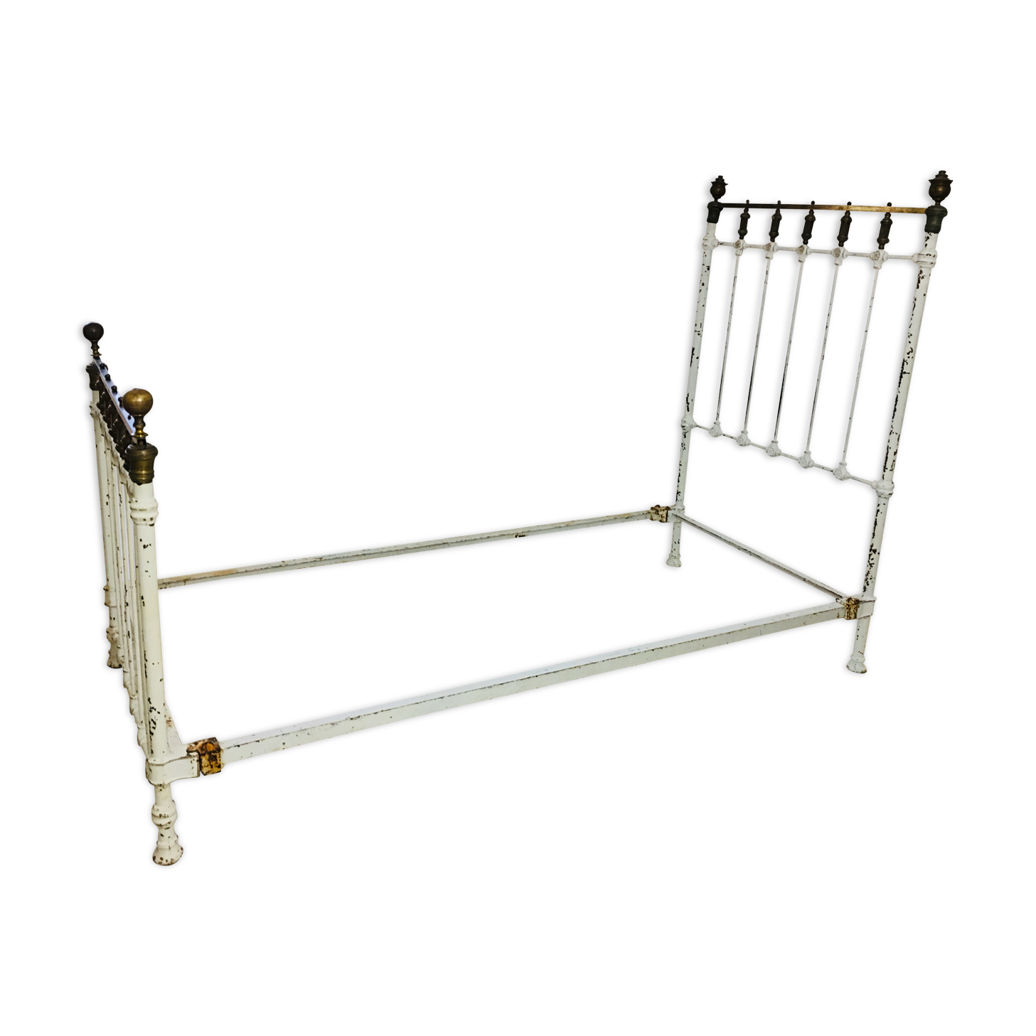 Old white metal and brass bed