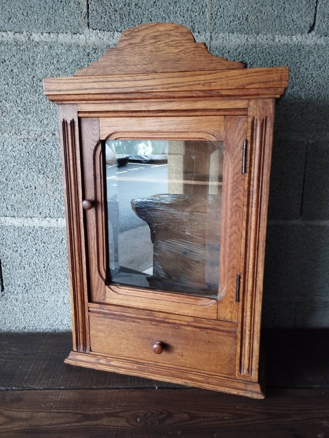 Old glass wall shelf with drawer door