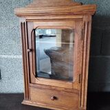 Old glass wall shelf with drawer door