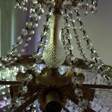 Antique castle style chandelier with tassels and floral details