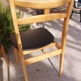 5 Scandinavian style chairs, wood and black faux leather.