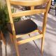 5 Scandinavian style chairs, wood and black faux leather.