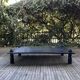 Table basse bois teinté noir brutaliste