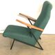 Lounge or easy chair with armrests