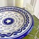 Decorative ceramic deep plate with fish decoration