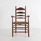Antique wooden armchair with cane seat, France ca. 1900