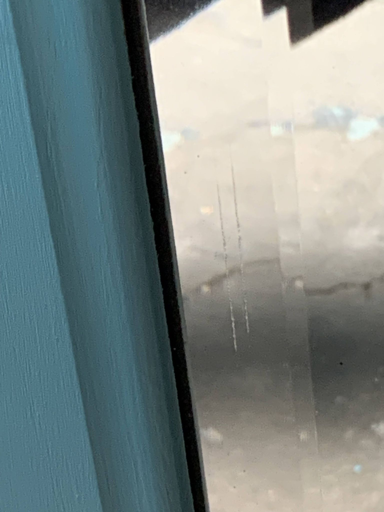 Beveled mirror on turquoise Parisian door