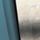 Beveled mirror on turquoise Parisian door