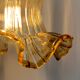 Gold bent wall light vintage tulip in amber glass.