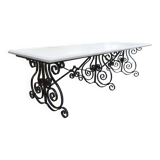 Marble table with wrought iron legs.