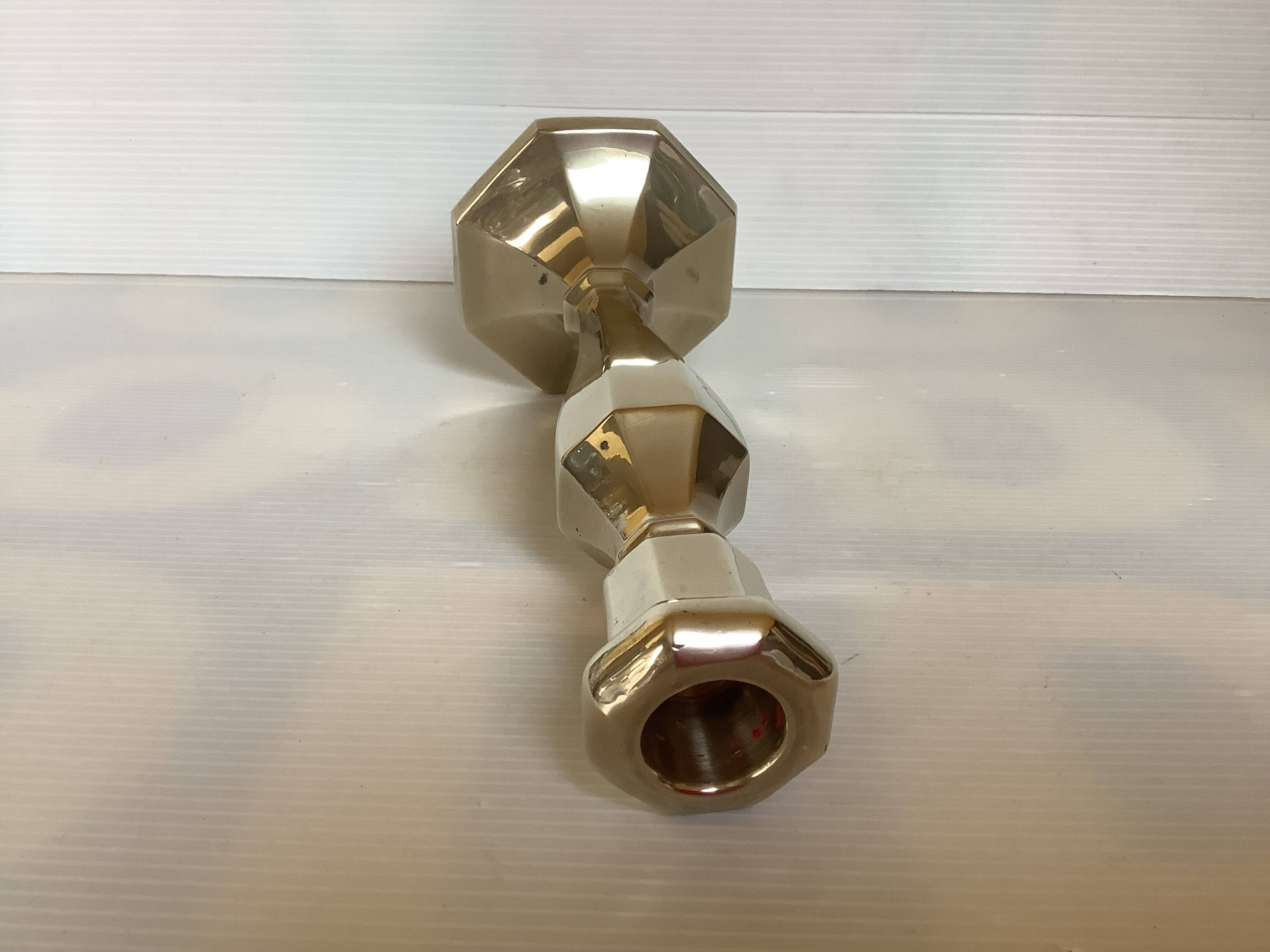 Faceted brass candle holder