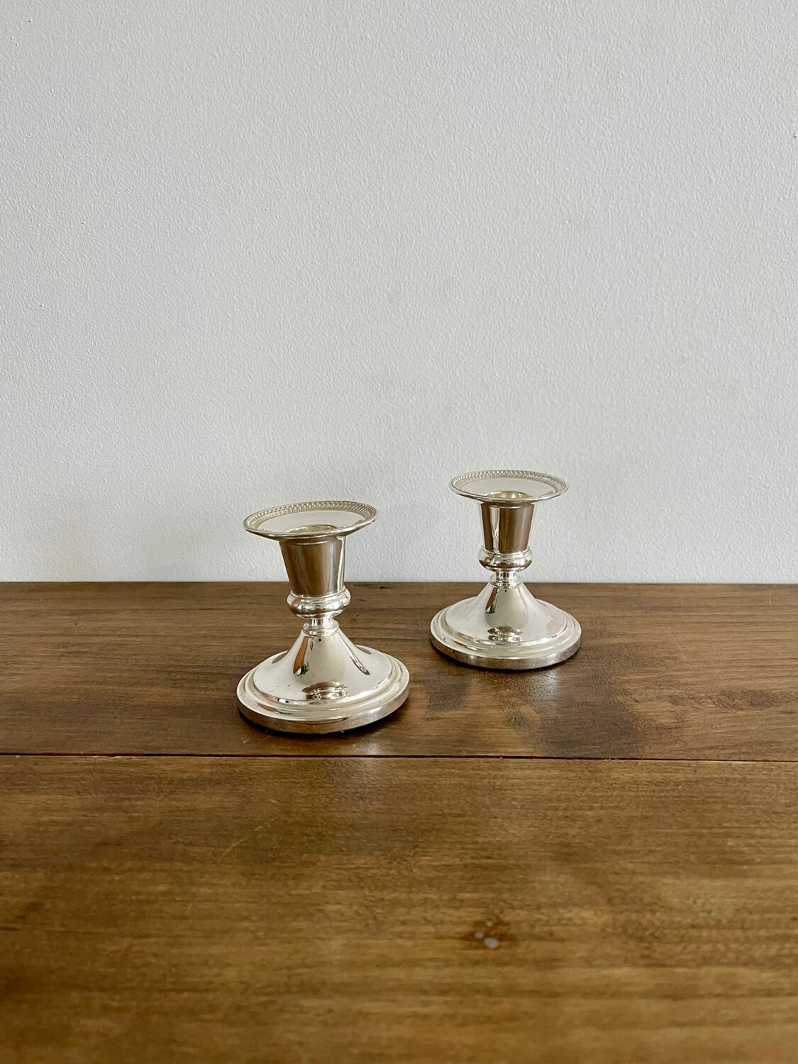 Pair of silver metal candle holders