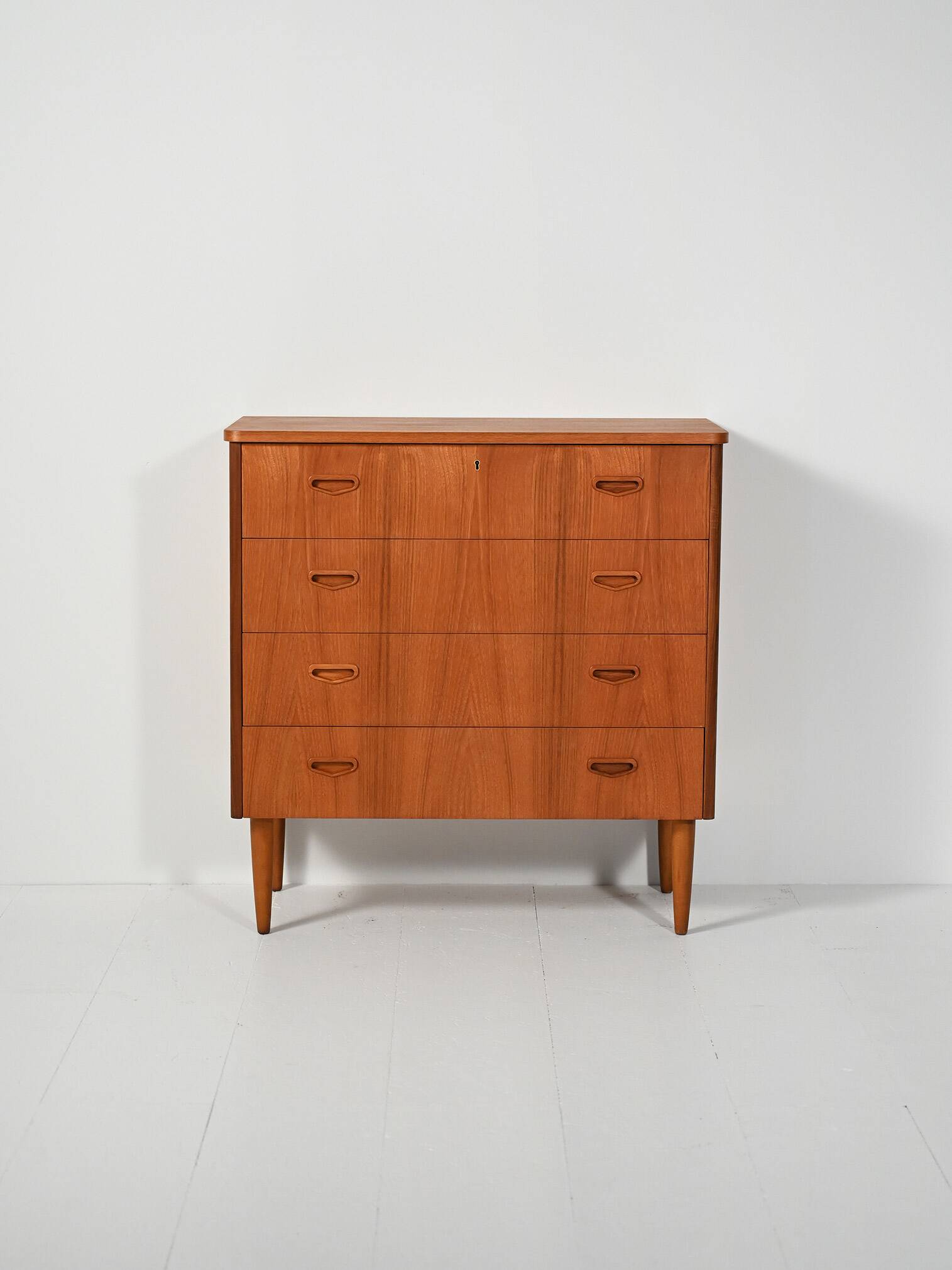 Scandinavian teak chest of drawers with sculpted recessed pulls