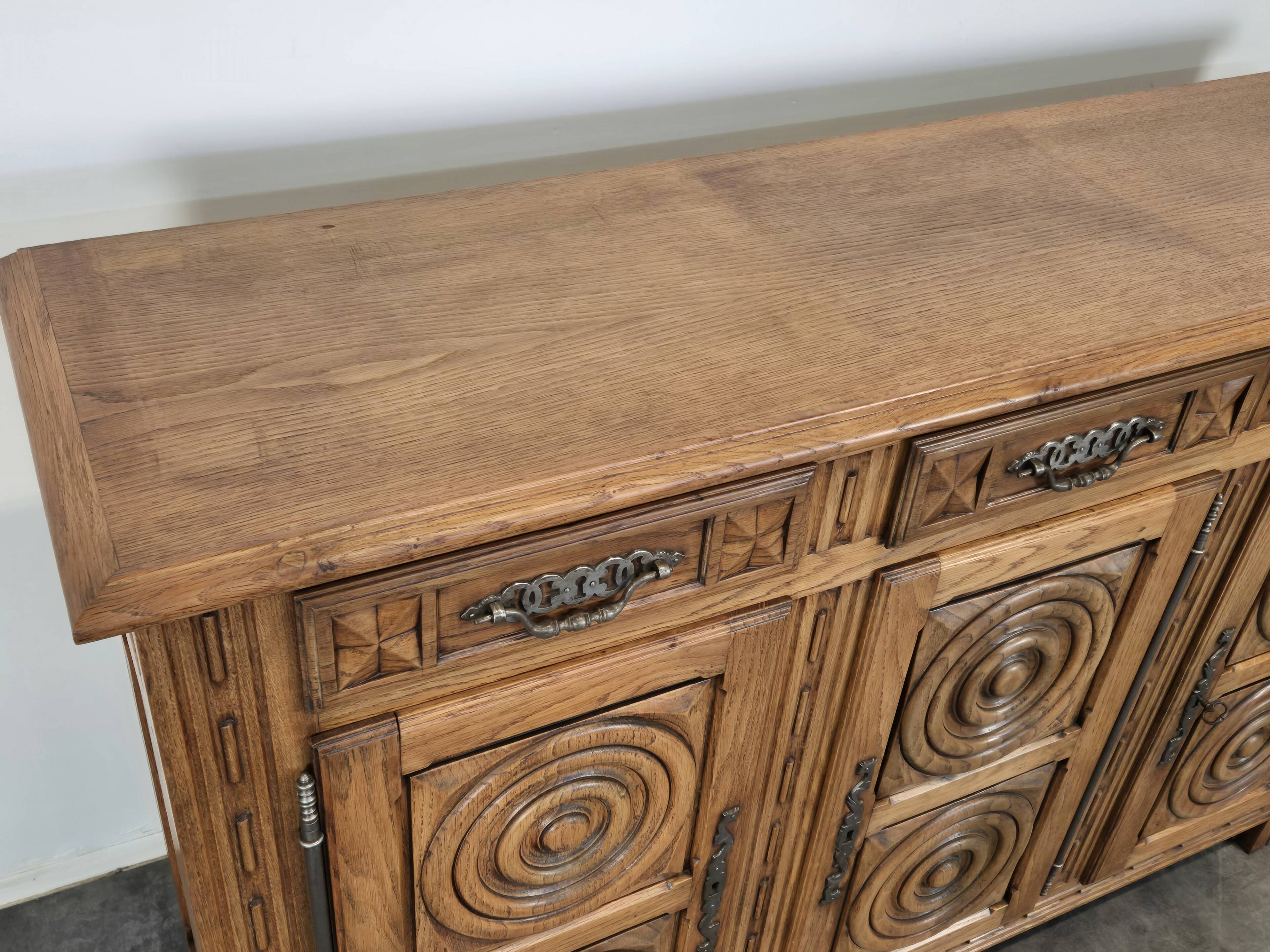 High sideboard in carved solid oak